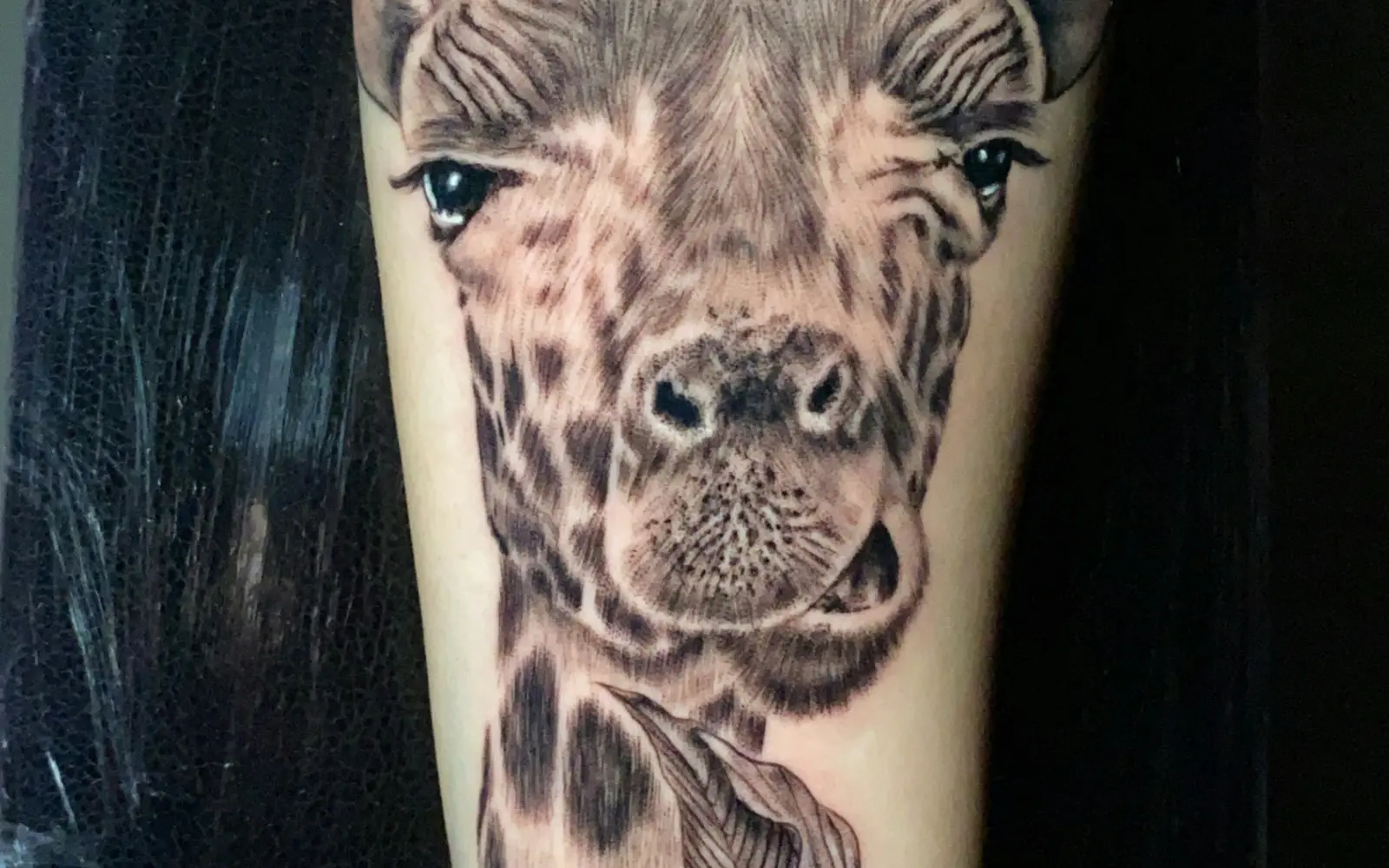 Giraffe tattoo on leg