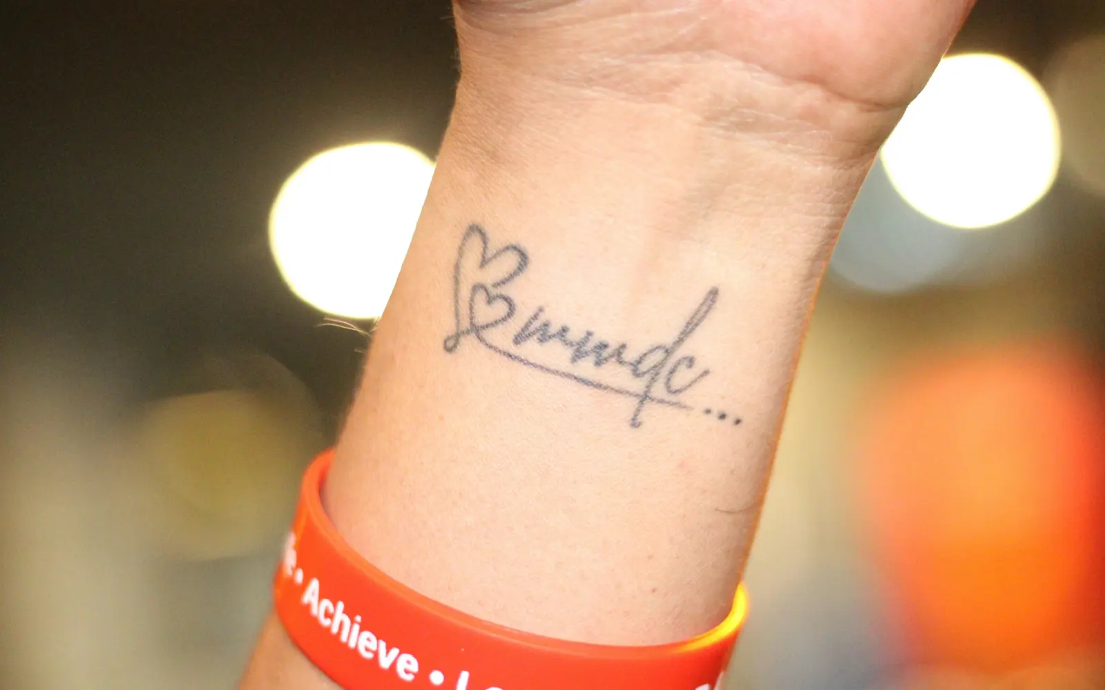 Wrist tattoo with handwritten memorial message
