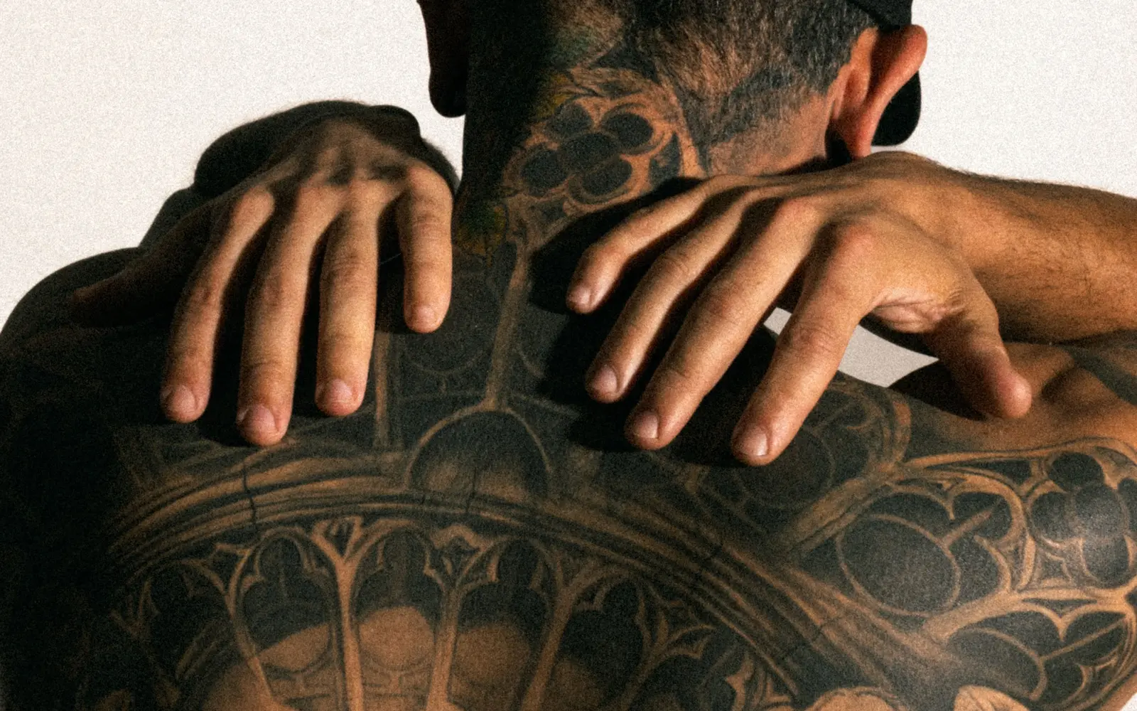 Man with intricate back tattoos