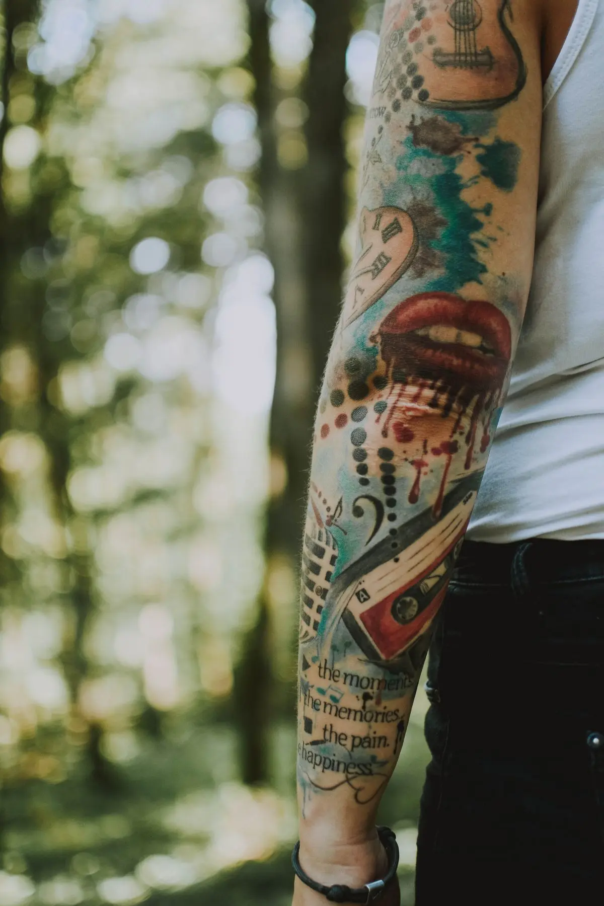 Watercolor forearm sleeve with paint-splash background and dripping color